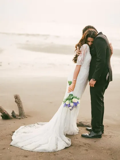An intimate embrace on the shore, where the world fades away leaving just two people. This is the essence of our fine art style, capturing the quiet, powerful connection between a couple in a timeless, cinematic frame.