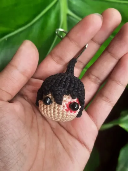 A clear shot of the custom Zuko amigurumi head. I use embroidery to create the details of his scar, making each one unique.