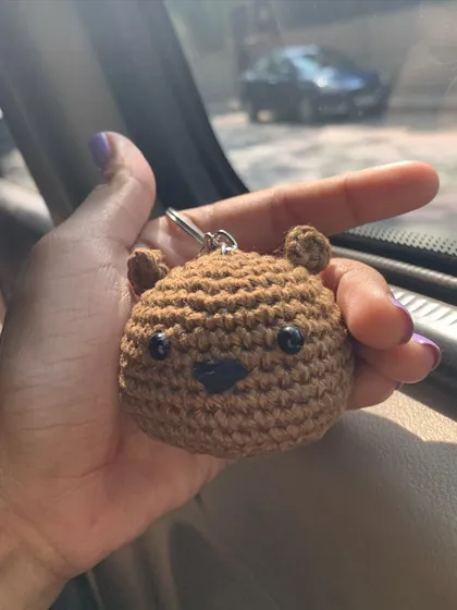 A simple and sweet bear face keychain, perfect for adding a touch of cuteness to your belongings.