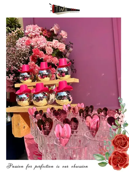 Fun and glamorous disco ball glasses with pink cowboy hats, a perfect example of how we tailor our glassware to match a party's theme.
