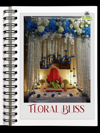 A "Floral Bliss" Ganpati decoration. We used cascading strings of white flowers and a canopy of blue hydrangeas to create an elegant and heavenly setting.