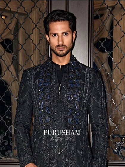 They enter in silence, dressed in thunder. This hand-embroidered black-on-black jacket is for the man who never asks for attention, but always gets it.