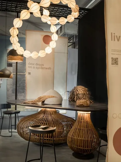 We believe in showing the craft behind the product. For this exhibition, we created a central community table with a beautiful lantana base where a craftsman could work live. This allowed visitors to see the skill involved and have conversations, deepening their understanding of the brand's handmade ethos.