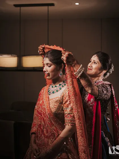 Before the world sees her as a bride, there are these quiet moments. A mother’s hands adjusting the veil one last time, a gesture filled with a lifetime of love. We believe the real story is in these unposed, in-between moments that are heavy with emotion.