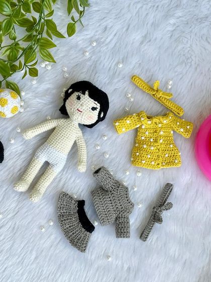 This special project was to recreate a little girl's first birthday outfits on her own mini replica doll. The doll comes with two removable dresses and accessories, making it a beautiful toy and a cherished memory keeper.
