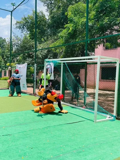 A goalkeeper making a crucial save during a penalty shootout drill. My specialized goalie training focuses on developing reflexes, correct positioning, and the confidence to face high-pressure situations like this. We work on everything from basic stance to advanced save techniques.