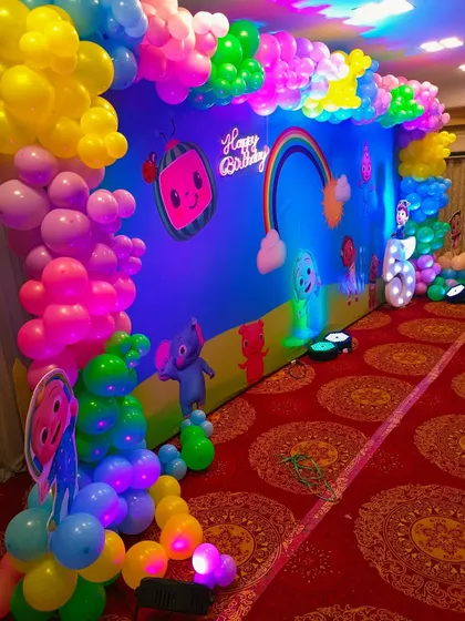 Another angle of the Cocomelon stage, showing the character cutouts.