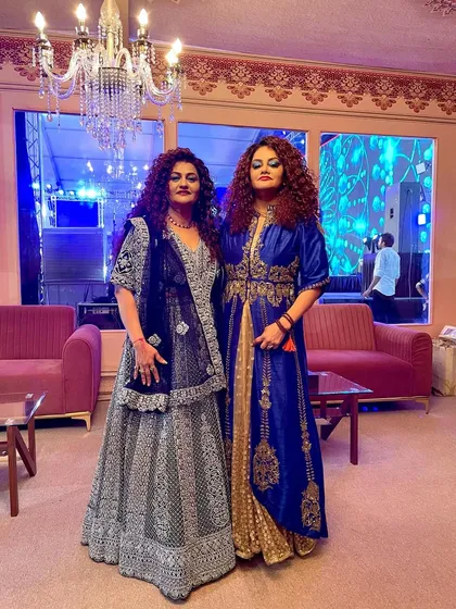 Backstage vibes. A final look before we head out to meet the audience. The grand chandelier and decor add to the royal feel of the event.