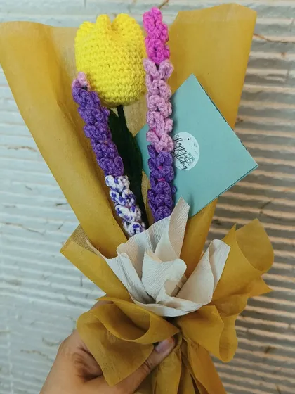 This custom bouquet features a yellow tulip and purple lavender stems, perfect for a birthday. We can mix and match different flowers to create a personalized arrangement for you.