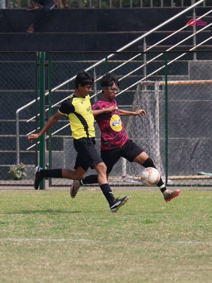 A fierce 1v1 battle for the ball, highlighting the competitive spirit we instill in our players.
