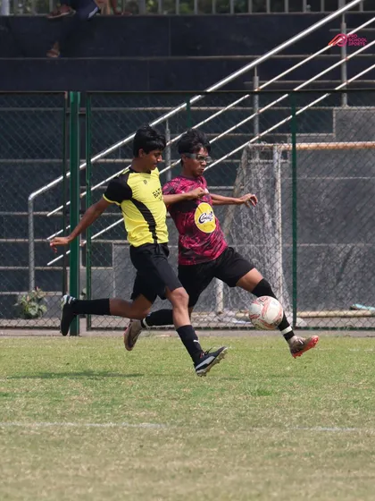 A fierce 1v1 battle for the ball, highlighting the competitive spirit we instill in our players.