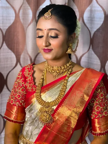 A close-up showcasing the soft, shimmery eye makeup and bold magenta lip I chose for Vidya. This combination enhances her features without overpowering her natural beauty.