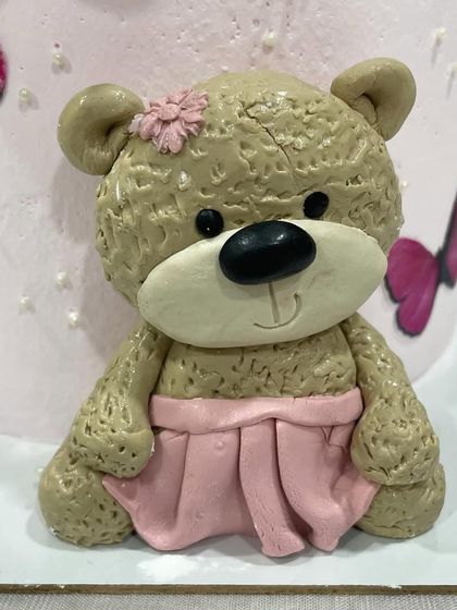 A close-up of the hand-molded fondant teddy bear. I love adding these little custom details to make a cake extra special.