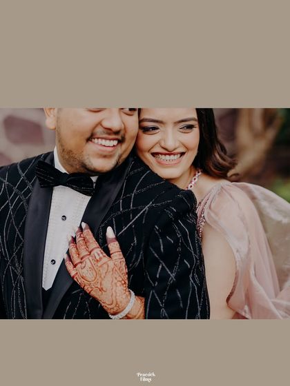 A close-up of the couple's beaming smiles. This candid shot captures the pure happiness and love they share.