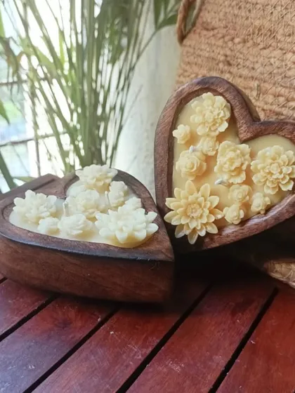 Two of our wooden heart candles, ready to be gifted. These make perfect wedding favors or thoughtful gifts, symbolizing love and warmth with their rustic charm and intricate floral details.