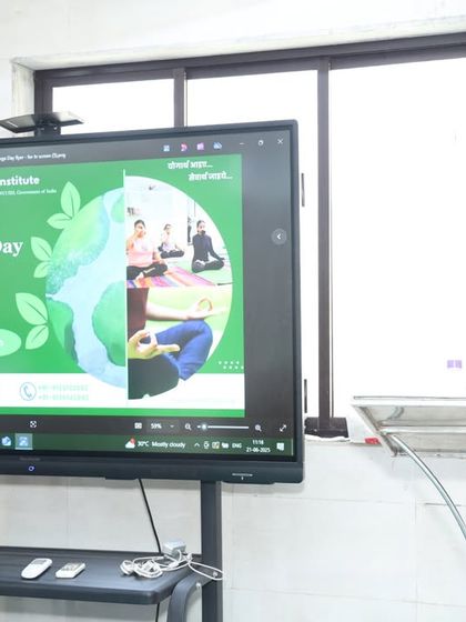 An instructor addresses the participants at our International Yoga Day event. We believe in educating our students about the theme and purpose of our practice, making it a holistic experience.