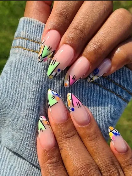 A client's photo of her amazing abstract art nails. This design features a mix of geometric shapes and colors on a neutral base for a modern, artistic look.