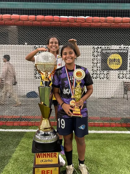 Our Best Forward, Nishka, posing with the BFL winner's trophy and her individual award.
