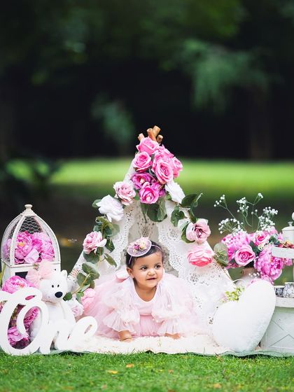 A sweet, curious expression from the birthday girl during her outdoor teepee photoshoot.