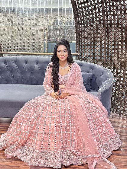 A smiling portrait of the happy client, showcasing her flawless engagement makeup.