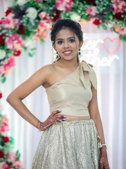 This client is rocking a chic, modern lehenga. Her makeup is clean and defined, with a stylish updo that completes the look.