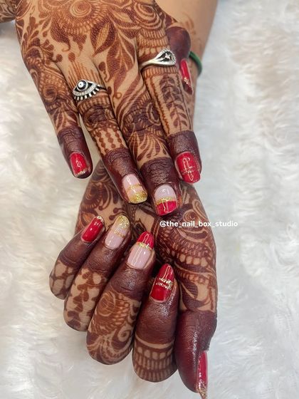 A close up of the detailed art on these natural bridal nails. I used fine lines and a touch of glitter to create a design that is both festive and sophisticated.