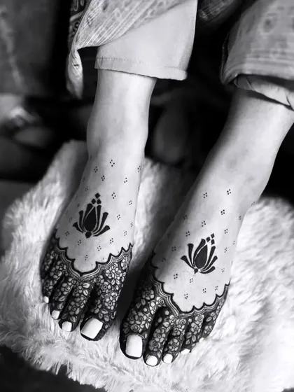 Mehandi is not just for hands. We create elegant and artistic designs for feet, like this minimalist lotus pattern, which adds a touch of grace from head to toe.