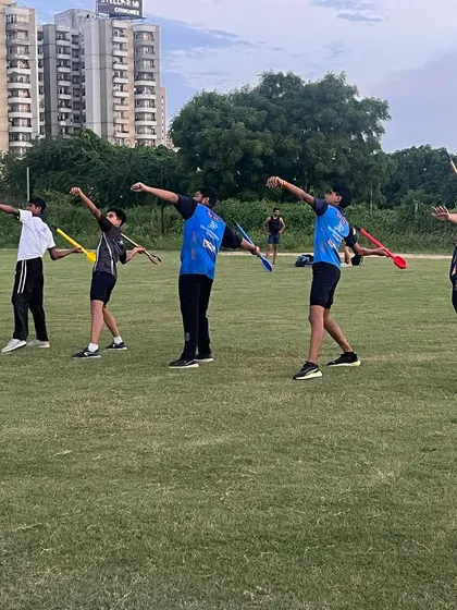 Young athletes doing javelin drills. We use kid-friendly equipment to teach the fundamentals of throwing safely.