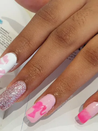 A detailed shot of the Barbie-themed nail art. I love how the glitter and different shades of pink work together.