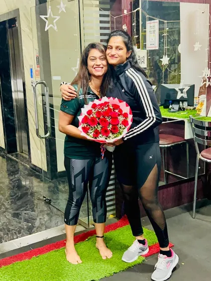 The bond between a trainer and a client is special. This picture captures the mutual respect and friendship that grows from working together.