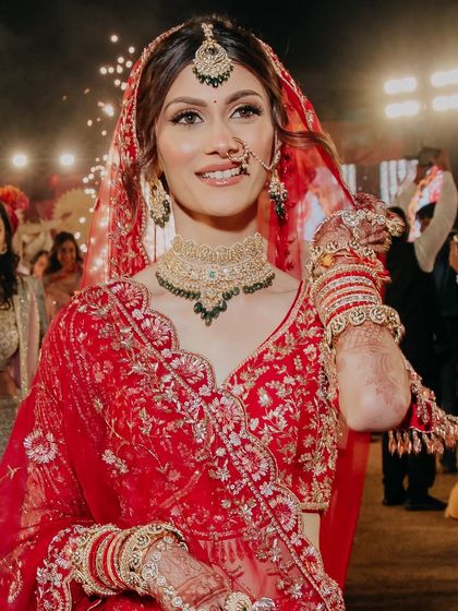 A happy, candid shot during the wedding festivities. The makeup is designed to last all night, from the ceremony to the party.