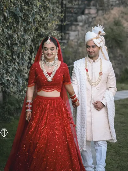The couple walking hand-in-hand after their ceremony, a classic shot symbolizing the start of their new journey.