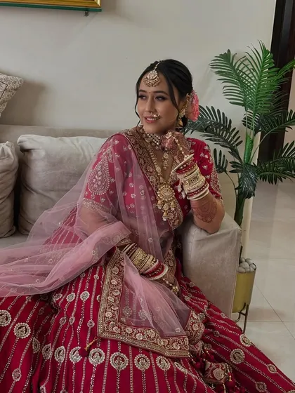 The bride seated comfortably, looking radiant and happy. My goal is to create a look that is not only beautiful but also comfortable to wear.