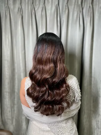 The deep, uniform waves create a polished and sophisticated look, perfect for a formal family function like a Roka.