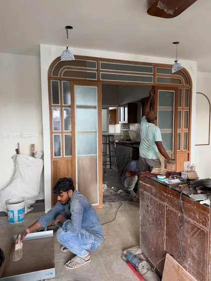 Here’s a look at the magic in progress. Our carpenters are installing a custom-designed arched door frame, a key element that will transform this entryway. It’s this level of on-site craftsmanship that turns a blueprint into a beautiful reality.