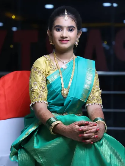 Niharika looking lovely for her half-saree function. The makeup is kept light and fresh, perfect for a young girl on her special day.