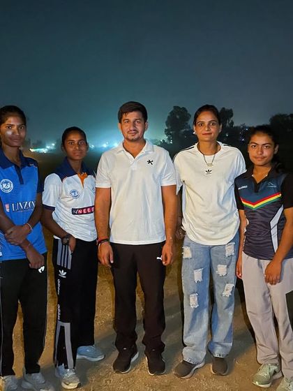 A quiet moment with the girls' team after a successful day. Success brings people together, but the struggle is where the real bonds are forged.