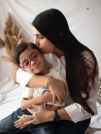 A tender moment between mother and son. These quiet, in-between moments are just as important as the smiling portraits, showing the deep love and connection in your family.