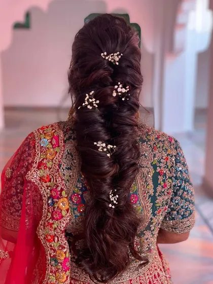 A volumized soft braid for the bride's D-day. I added baby's breath for a touch of elegance. This style is perfect for keeping long hair managed and beautiful.