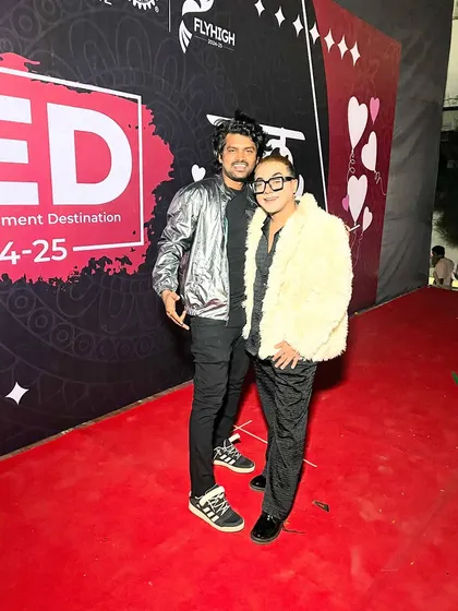 On the red carpet with a fellow artist. It's great to connect with other creative people in the industry.