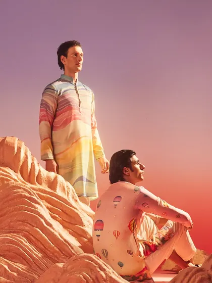 Two distinct moods from the same artistic collection. This image showcases the versatility of our printed silk kurtas, from soft pastels to vibrant waves of color.