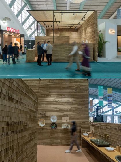 A composite image showing the Aquant stall in the context of the larger exhibition hall and a close-up of its interior. This highlights how the design stands out for its unique and sustainable materiality.
