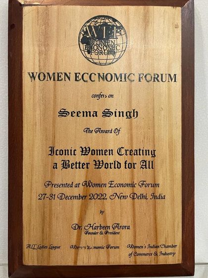 The plaque for the "Iconic Woman Award" from the Women Economic Forum. This award reinforces my mission to bridge the gap in wellness and well-being for everyone.