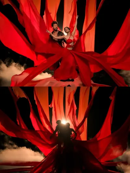A dramatic shot from the music video for 'Bahli Sohni' from Baaghi 4. We used powerful backlighting to create this striking silhouette effect with flowing red fabric, highlighting the romantic and high-production value of the scene.