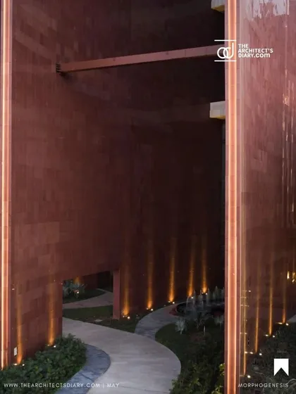 The landscaped pathways at the base of the Surat Diamond Bourse are illuminated at night, creating a welcoming and secure environment. These spaces are designed to encourage movement and interaction even after business hours.