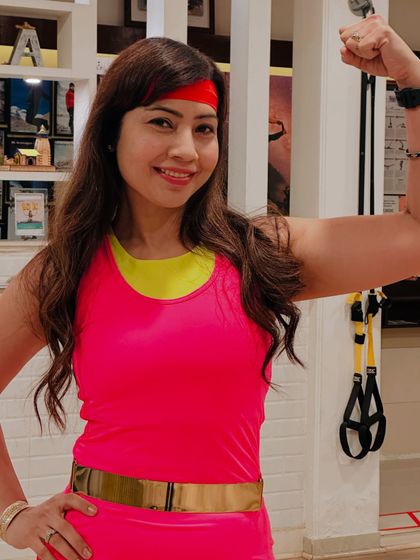 A close-up showing the energy and fun of our 80s workshop. Themed events like this are a great way to bring our community together, build camaraderie, and prove that workouts can be a celebration.