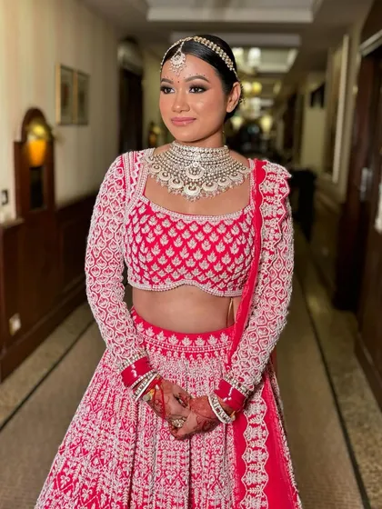 Rubina looking absolutely stunning and ready for her wedding. The makeup is bold yet elegant, perfect for a bride.