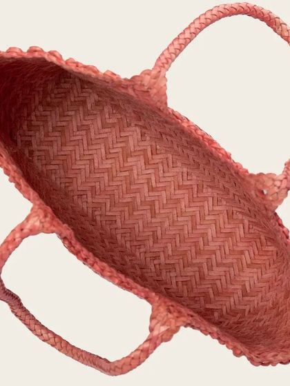 An overhead view of the Axel Large Tote, showing the spacious interior. The entire bag, inside and out, showcases the beauty of the handwoven leather.