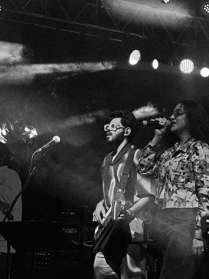 A candid moment on stage with my bandmate. These interactions are a key part of our live dynamic, creating a fun and engaging show.