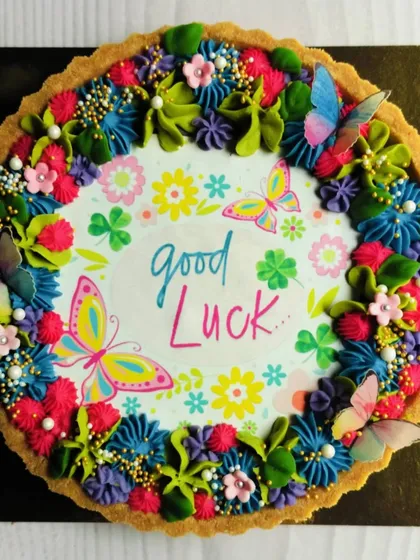 A full view of the 'Good Luck' tart, showcasing the intricate floral and butterfly details that make it so special. Every element is crafted with care to send the sweetest wishes.
